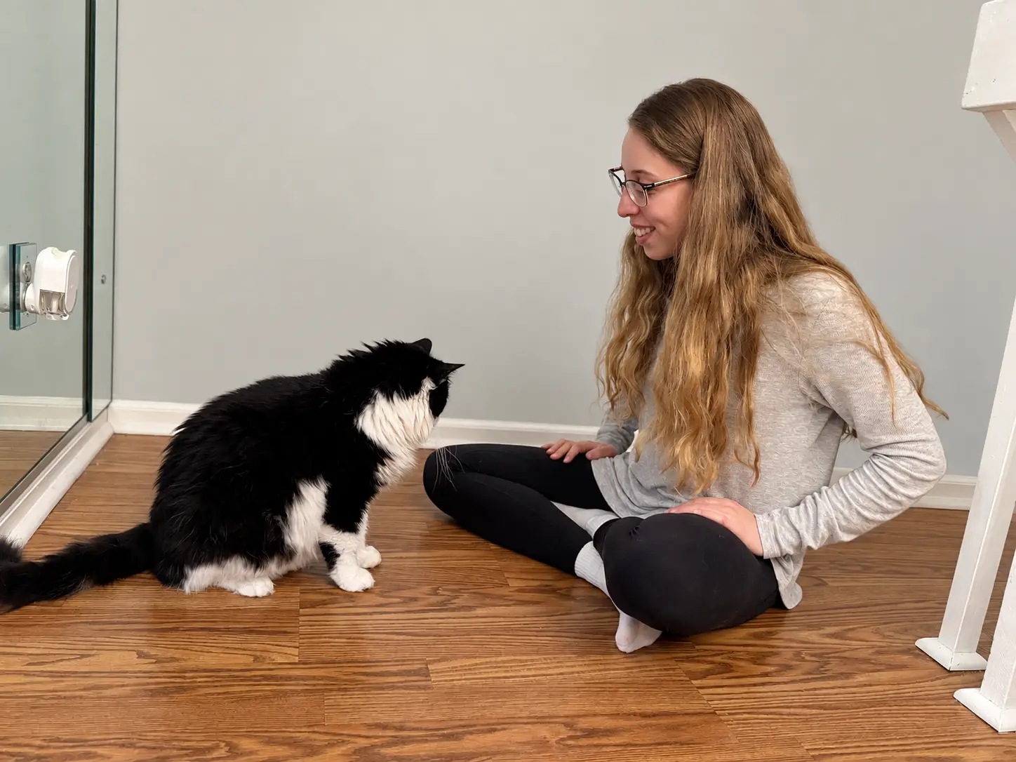 Julie kneeling with a dog